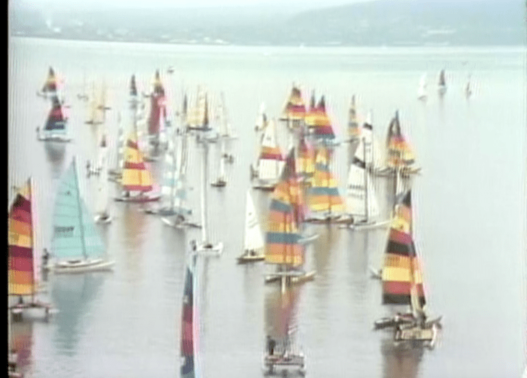 Colorful sailboats sit atop Bellingham Bay